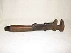 ANTIQUE PIPE WRENCH WITH WOOD AND COPPER HANDLE MECHANI
