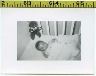 Vintage 1950s photo / Sweet Baby in Crib with Black Kitty Cat Toy in 