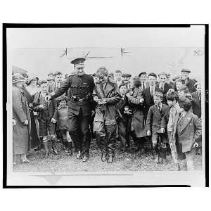  Amelia Mary Earhart surrounded by crowd of admirers in 