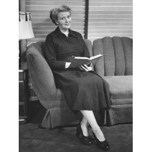  Senior Woman Sitting on Sofa, Holding Book Photographic 