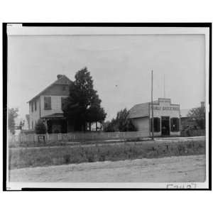  House with picket fence next to Lee Bros. Family 