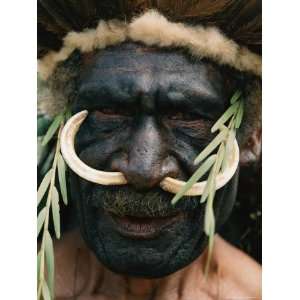  Elaborate Headdress and Boar Tusks Decorate the Face of a 