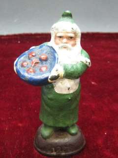 ANTIQUE GREEN SANTA CLAUS   METAL SIGNED 1888   5 TALL  