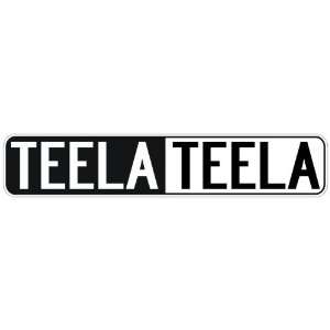   NEGATIVE TEELA  STREET SIGN