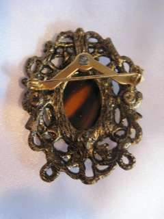 Vintage Amber Striped Glass Stone Brooch Ornate Frame Antiqued Gold 