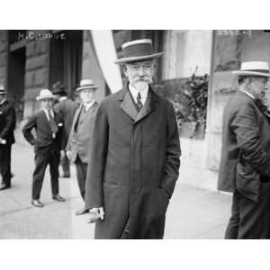  early 1900s photo H.C. Lodge, 3/4 standing on sidewalk 