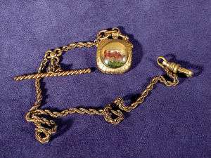 ANTIQUE CATTLE WATCH FOB AND CHAIN  