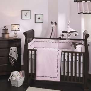 Cute pink and brown baby bedding in a baby girls nursery