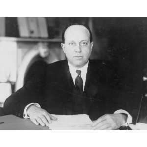 1930s photo Eugene Meyer, half length portrait, seated at desk, facing 