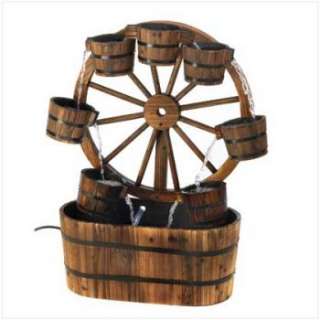 Country charm abounds in this casual all wood water fountain An old 
