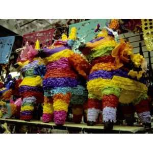  Several Brightly Colored Pinatas Await Buyers in a Mexican 